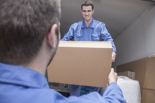 Man and van service loading items into a van