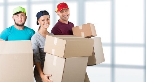 Professional helper carrying furniture during a Richmond upon Thames move