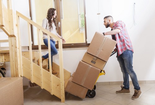 Professional man and van in Richmonduponthames loading furniture safely