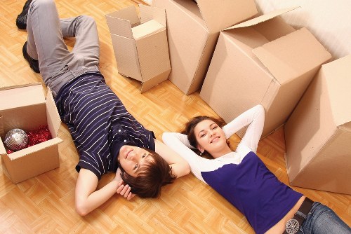 Removal team handling furniture during a Richmond upon Thames house move