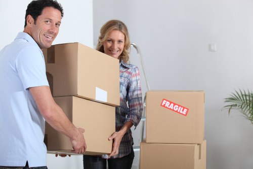 Careful loading of household furniture into a removals vehicle